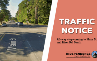 a traffic notice ad showing one half of main street and river road south and one half text. the background is pink